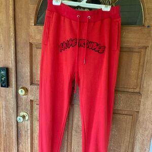 Red Joggers with 'Raise Trouble' Print